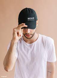 Download Premium Psd Of Man With A Black Cap Mockup 1235598 Black Cap Grey Long Sleeve Shirt Wearing Black
