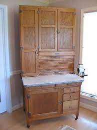 Antiquing cabinets is the process of applying a dark glaze to a lighter cabinet door, to give it the appearance of old age and wear and tear. Antique Early 1900s Genuine Sellers Extra Tall Hoosier Kitchen Cabinet Hoosier Cabinets Vintage Cupboard Find Furniture