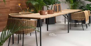 At each corner of this café there are various green plants with small flowers. Outdoor Dining Cafe Tables Linea Inc Modern Furniture Los Angeles