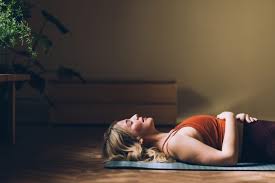 Exhausted person finding rest on yoga mat