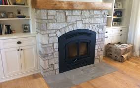 thin veneer natural stone fireplace. by