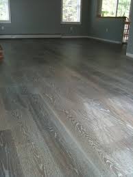 Grey and white laminate hardwood grey and white washed laminate hardwood is currently one of the biggest trends in the hardwood business. True Wesson Interior Design Project Gray Hardwood Floors Grey Hardwood Floors House Flooring Grey Hardwood