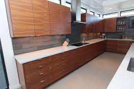 I Like The Grey Walls With White Countertop And Wood Cabinets Flat Panel Doors Walnut Kitchen Cabinets Kitchen Cabinet Color Schemes