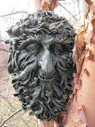 Green man statue and sailboat. Pin On Garden Decor