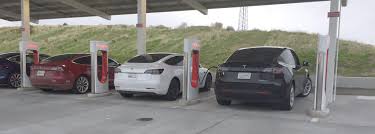 Charging a tesla is just like charging your iphone. Tesla Model Y Spotted Supercharging Side By Side With A Model 3 Tesla Model Y Tesla Model Model Y
