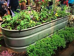 The website mary janes farm presents a very well done pdf instruction using sections of pvc pipe to support a perforated soil platform. Horse Trough Used As A Garden Planter One Hundred Dollars A Month