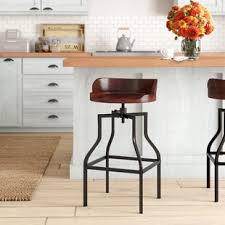 Copper would compliment really well with a turquoise green; Farmhouse Bar Stools Birch Lane