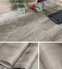 The paper shelf edging was, i am quite sure, a way for women to dress up their farmhouse and apartment kitchen shelves without having to go to the expense of renovating. Amazonsmile Decorative Gray Oak Wood Contact Paper Vinyl Self Adhesive Shelf Drawer Liner F Diy Kitchen Cabinets Diy Contact Paper Cabinets Desk Makeover Diy