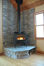 This Is A Great Corner Woodburning Stove With A Nice Roaring Fire Note The Wood Storage On The R Wood Burning Stove Corner Corner Wood Stove Wood Stove Hearth