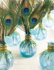In which case, peacock accessories are your ticket to a stylish arrangement. Table Settings Peacock Centerpieces Peacock Wedding Theme Wedding Centerpieces