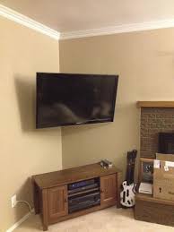 This full motion tv wall mount allows you to maximize space by mounting your tv in a corner by adjusting the mount's articulating arms. 10 Tv Cabinet Ideas And Mounting System Best For A Small Living Room Simphome Corner Mounted Tv Corner Tv Corner Tv Mount