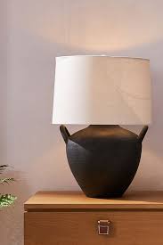 The ceramic jug shape table lamp with empire shade can add some charm to a living space. Amber Lewis For Anthropologie Marana Table Lamp Anthropologie