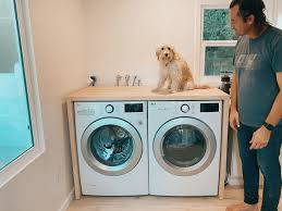 Laundry room countertops over the washer and dryer units make for a convenient work surface when you're taking clothes out of the drying machine. Diy Waterfall Butcher Block Washer Dryer Counter We The Dreamers