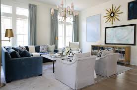 This is the sectional we have in our basement. Blue Velvet Sectional With Brass Floor Lamps Transitional Living Room