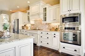 Mini brick marble backsplash graces a gorgeous white kitchen with a stainless steel. White Kitchen Cabinets Off White Kitchen Cabinets White Kitchen Cabinets With Granite Paint Kitchen Cabinets White White Kitchen Cabinets With Granite Antique White Kitchen White Kitchen Design White Kitchen Interior