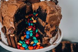 This chocolaty fudgy treat is truly this cake is made with three layers: Chocolate Overload Pinata Cake Recipe By Erin Aschow