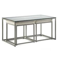 This piece comes in your choice of available finishes, polished for an extraordinary shine, and topped in thick, clear glass, tempered for extra strength. Cubic Nesting Coffee Table With Ottomans Creative Classics