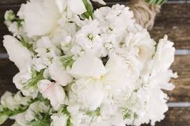 A nosegay made up of concentric circles of different flowers for a somewhat striped effect. How To Make A Hand Tied Wedding Bouquet Wedding Flowers Topweddingsites Com