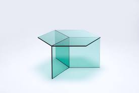 A glass coffee table makes for an elegant, subtle addition to the room, while a coffee table with storage is perfect for creating space for a striking centerpiece. Coffee Table Isom Square Clear Green The Space Berlin