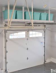 With these cheap garage storage ideas, you can guarantee it stays clean longer than just a few minutes. Overhead Garage Storage Shelf Her Tool Belt