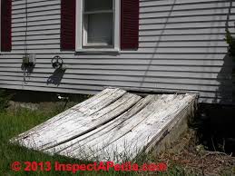 They had a black thick plastic runner on them, and underneath was red paint and transition strips on the edge. Basement Walk Out Covers Accessways Basement Exit Stair Covers Construction Safety