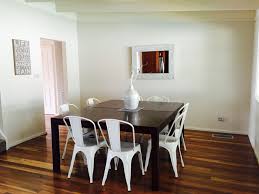 Dining Room Dark Timber Table White Metal Chairs White And Timber Dining Setting White Mirror Floor Board Dark Dining Room White Metal Chairs Modern Dining