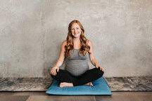 Join us for an explorative practice where you'll attune to your soothed self. Pregnant Woman On Yoga Mat Beside Concrete Wall Stockphoto