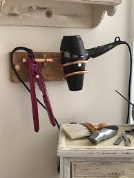 Luckily, 2021 offers some nice gadgets that can help you speed through your blow drying routine without straining your arms and shoulders. Blow Dryer Hair Dryer And Hairdressing Tool Holder Hair Salon Or Bathroom Bedroom Dressin Hair Straightener Holder Hair Dryer Holder Straightener Holder Diy