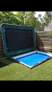 Pool Covered By A Trampoline Brilliant Brilliant Covered Pool Trampoline In 2020 Small Backyard Pools Pool Cover Diy Pool