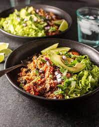 Instant Pot Vegan Quinoa Burrito Bowls On A Plate With Avocado Slices On Top Vegan Instant Pot Recipes Vegetarian Instant Pot Pot Recipes