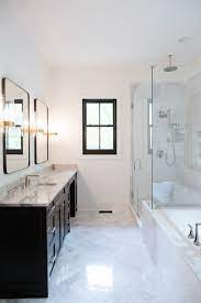 Although marble will typically be used in a classically design master bathroom, it when you have a master bathroom that's going to be featuring dark wood and yellow notes, red marble can work. White Marble Master Bathroom With Black Accents The Tile Shop Cristin Cooper Ex White Marble Bathrooms Modern Master Bathroom Remodel White Master Bathroom
