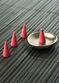 Incense comes in many forms, the most commonly found being cone and stick incense. Incense Cone Burning Stock Photo Dissolve