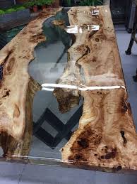 Resin tabletop with stones sitting on a saarinen style table base. Epoxy Resin Table Epoxidharz Ideen Novocom Top