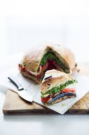 Roasted vegetable pesto panini is a delicious sandwich, full of healthy roasted vegetables along with a spreading of pesto, and topped with cheese! Grilled Eggplant Muffuletta Sandwich Feasting At Home