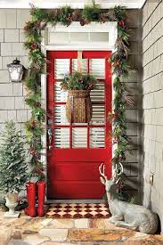 One simple way to decorate a door for christmas is to swag one long strand of greens along the perimeter of the doorway. Simply Inspired Holidays Decorating Your Front Door Front Door Christmas Decorations Front Porch Christmas Decor Christmas Decorations