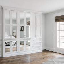 Men's gray walk in closet featuring a tv and apple computer in the center or built in shelving finished with gray greek key ceiling wallpaper. 75 Beautiful Built In Closet Pictures Ideas June 2021 Houzz