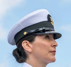 Rear Adm. Greg Emery proudly presented CDR Karen Camp with the prestigious  Vice Admiral Rufus L. Taylor Award for Leadership. This esteemed award  honors Active or Reserve Component officers, enlisted personnel, or