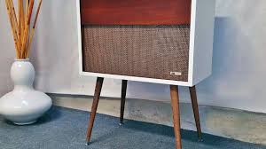 Geometric side panels frame the sides, fortifying this storage cabinet as a stable, sturdy, and sophisticated addition to your home bar. Arvin Refurbished Mid Century Modern Record Player Console With Bluetooth Youtube
