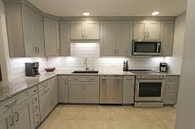 Gray backsplash tile marble , glass, subway kitchen and bathroom projects, ideas and photos. Grey Kitchen With White Subway Tile Backsplash And Granite Countertops Copley Transitional Kitchen Cleveland By Cabinet S Top Houzz Uk