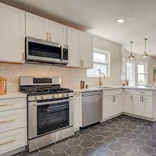 The kitchen was totally redone with a sort of plywood cabinet covered in a vinyl, countertops and backsplash however, the bathroom floors were left intact. Tile Trends Why Choose Hexagon Tiles