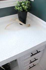 Embed the squares of mosaic tile in the adhesive, positioning them carefully so the joints between the squares are even. How To Paint Tile Countertops And Our Modern Bathroom Reveal Bright Green Door