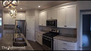 Fun accessories including a found animal scull and wrought iron climbing men add playfulness to this wet bar. Robinwood Fieldcrest Homes Effingham Home Builders