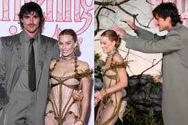 Jacob Elordi Rushes in to Shield Margot Robbie from the Rain and Protect Her Red Carpet Look at Wuthering Heights Premiere in London