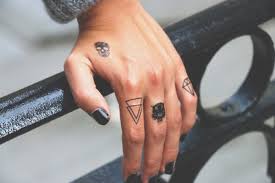 The tattoos are tiny as it needs to get fitted on the fingers. Finger Tattoo Over 70 Cool Themes And Their Meaning Tcg Trending Buzz