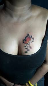 Here S A Butterfly Tattoo In Beautiful Lady Chest Symbolic Meanings And Placement Are Two Important Thing When Peo Secret Tattoo Tattoos Butterfly Tattoo