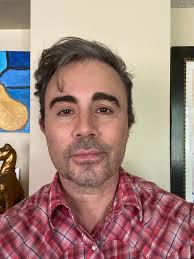 Guys, I need a proper headshot for a role. I'm trying to get. ￼ this is a  selfie. Is there anyway someone can just make it a solid background?