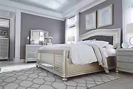 There's also some kind of perfect round stain on the wood on the back (see picture). Coralayne Queen Panel Bed Ashley Furniture Homestore