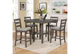 For an upscale aesthetic in the dining room, opt for a marble table and upholstered counter stools. Belfort Essentials Tahoe 5 Piece Counter Height Table And Chairs Set Belfort Furniture Pub Table And Stool Sets