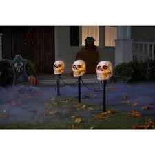 Because of the cold and darkness, winter. Lightshow Flickering Skulls Halloween Pathway Markers 3 Count Ractae Home Decor