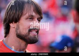 Denver Broncos quarterback Jack Plummer, left, shakes hands with fullback  Kyle Johnson, left, after Johnson's one-yard touchdown-reception against  the Oakland Raiders in the second half of an NFL football game in Oakland,
